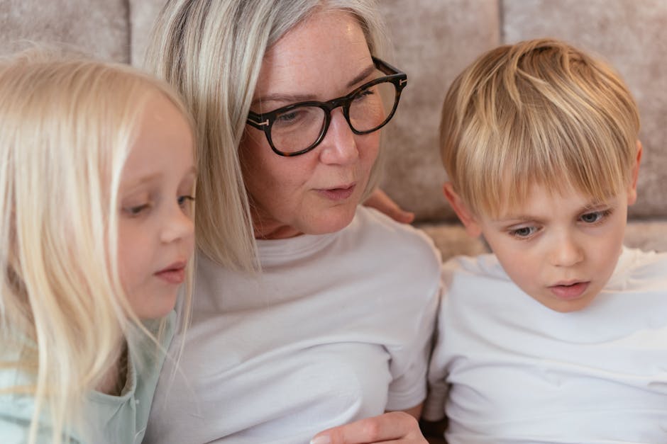 A grandmother and her grandchildren enjoy quality time together indoors.